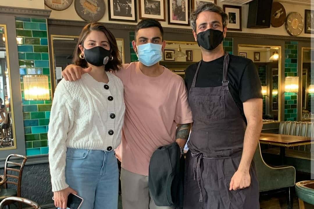 Anushka Sharma & Virat Kohli along with the chef of Restaurant 