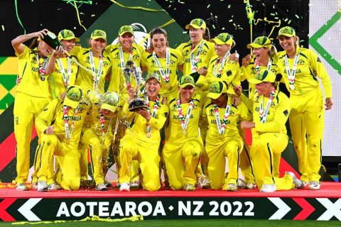 Australia celebrate with the trophy after winning the 2022 ICC Women's Cricket World Cup Final