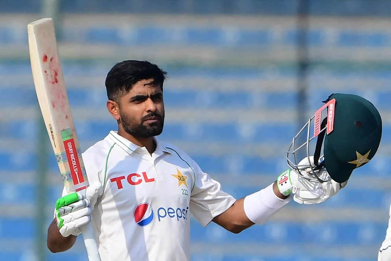 Babar Azam raising his bat after century