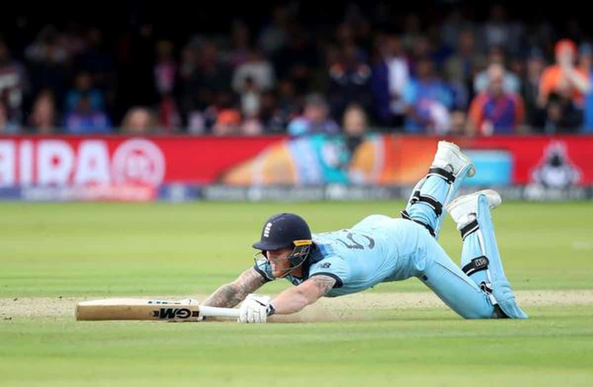 Ben Stokes dives to reach the crease and the ball deflected off him to run to the boundary.