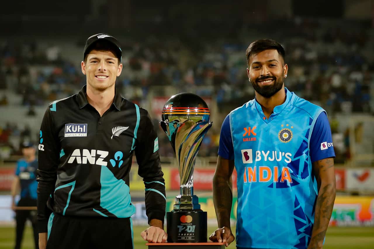 IND vs NZ Dream11 Prediction With Stats, Pitch Report & Player Record of New Zealand tour of India, 2023 For 3rd T20I Mitchell Santner & Hardik Pandya with T20I Trophy of New Zealand tour of India 2023