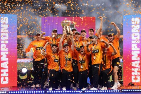 Perth Scorchers players celebrate with the trophy after winning the Big Bash League 2022-23