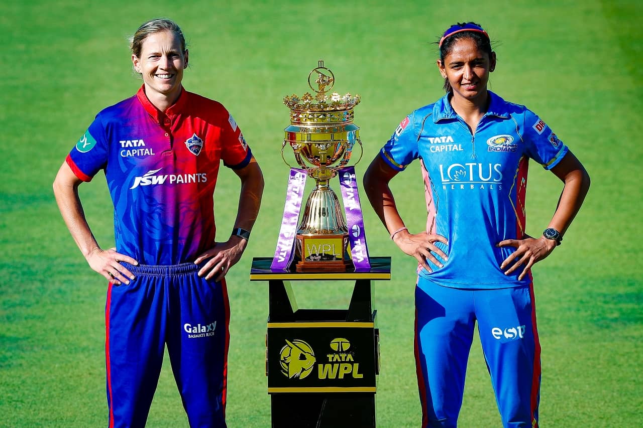 Meg Lanning of Delhi Capitals and Harmanpreet Kaur of Mumbai Indians with WPL Trophy