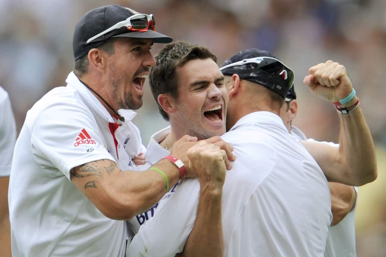 James Anderson celebrates with teammates Kevin Pietersen & Matt Prior