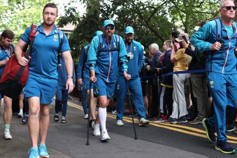 Nathan Lyon arrives on crutches after injuring his calf