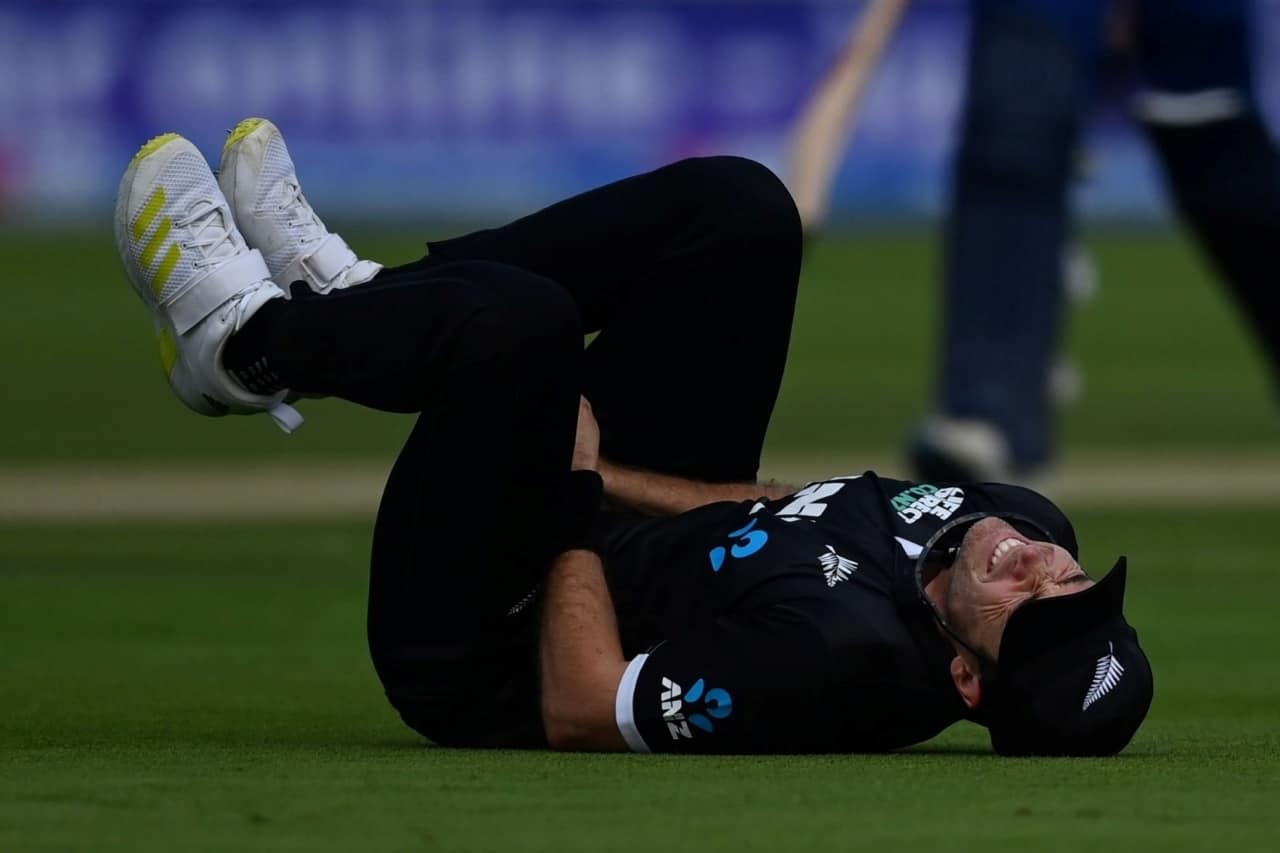 Tim Southee lies on the ground after injuring his thumb while attempting a catch