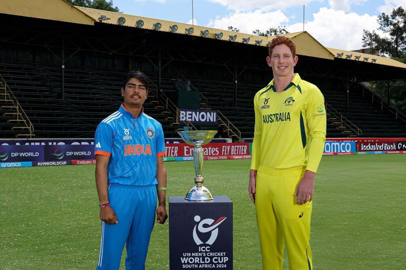 Uday Saharan, Captain of India and Hugh Weibgen, Captain of Australia pose next to the ICC U19 Men's trophy ahead of the Final